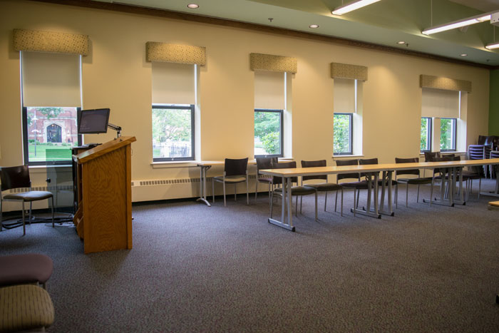 inside view of a classroom with windows and chairs